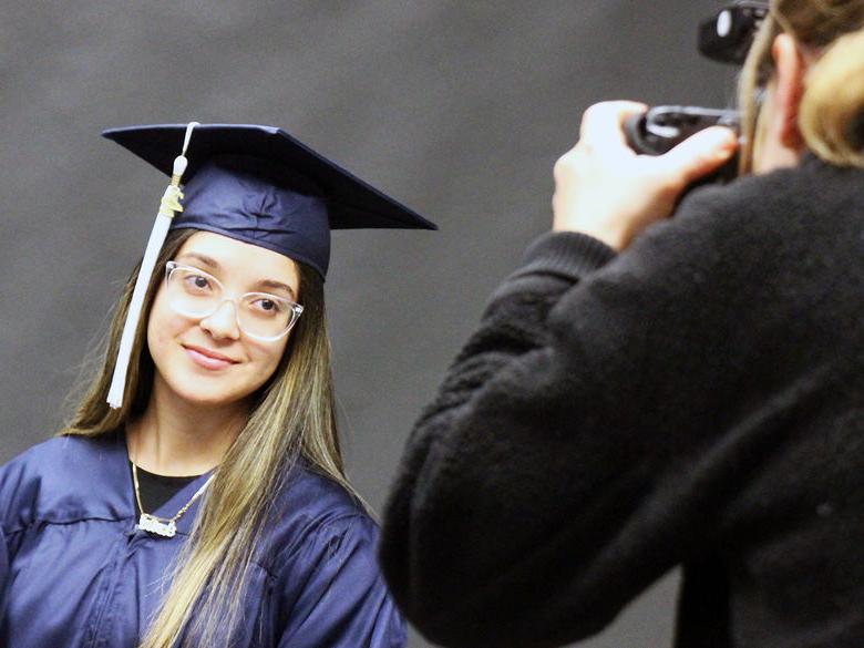 Senior getting their picture taken during Salute to Seniors Day